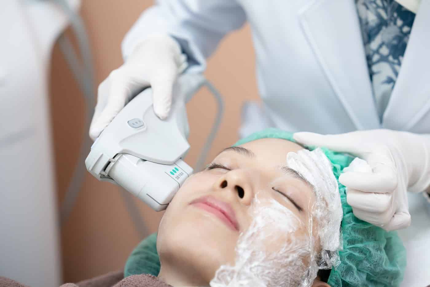 a woman receiving a Ultra Sound Therapy by Synergy Wellness in Oceanport, NJ